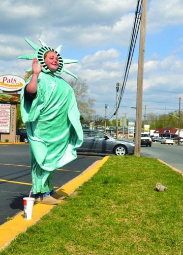 ON THE JOB: Costumed waver for Liberty Tax Services | Business |  cecildaily.com