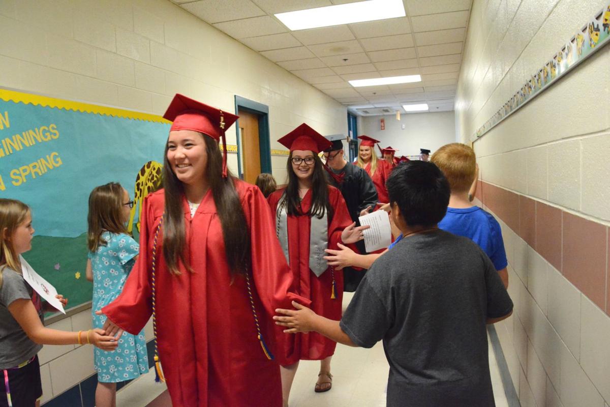 Bo Manor seniors tour Cecilton Elementary in caps and gowns Schools