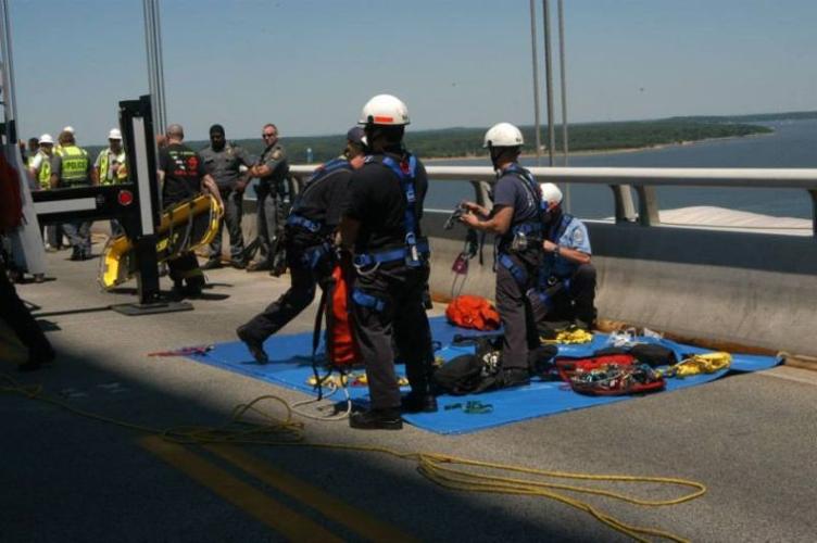 Emergency crews rescue injured worker from beneath bridge ...