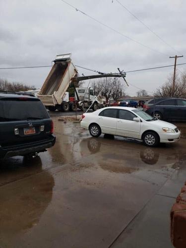 Dump truck bed catches power line, causes isolated outage in Washington ...
