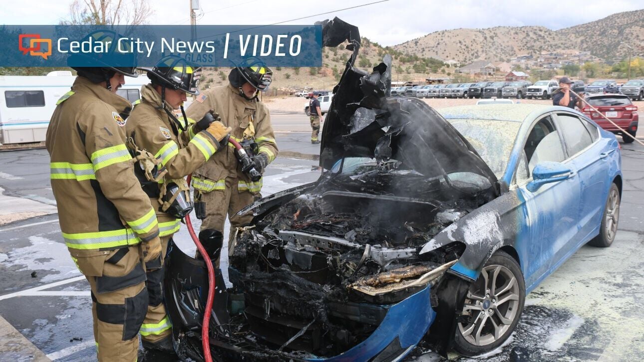 Firefighters extinguish overheating car after it catches fire in Cedar City parking lot