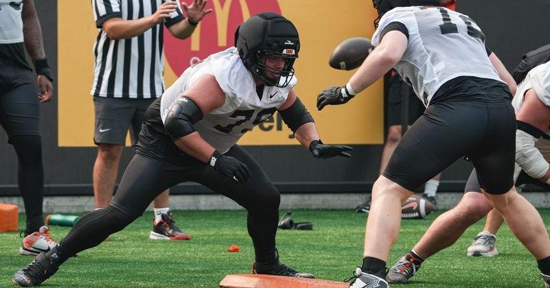 Oregon State's Tyler Voltin, left, does blocking drills during fall camp Aug. 5 at Reser Stadium in Corvallis.