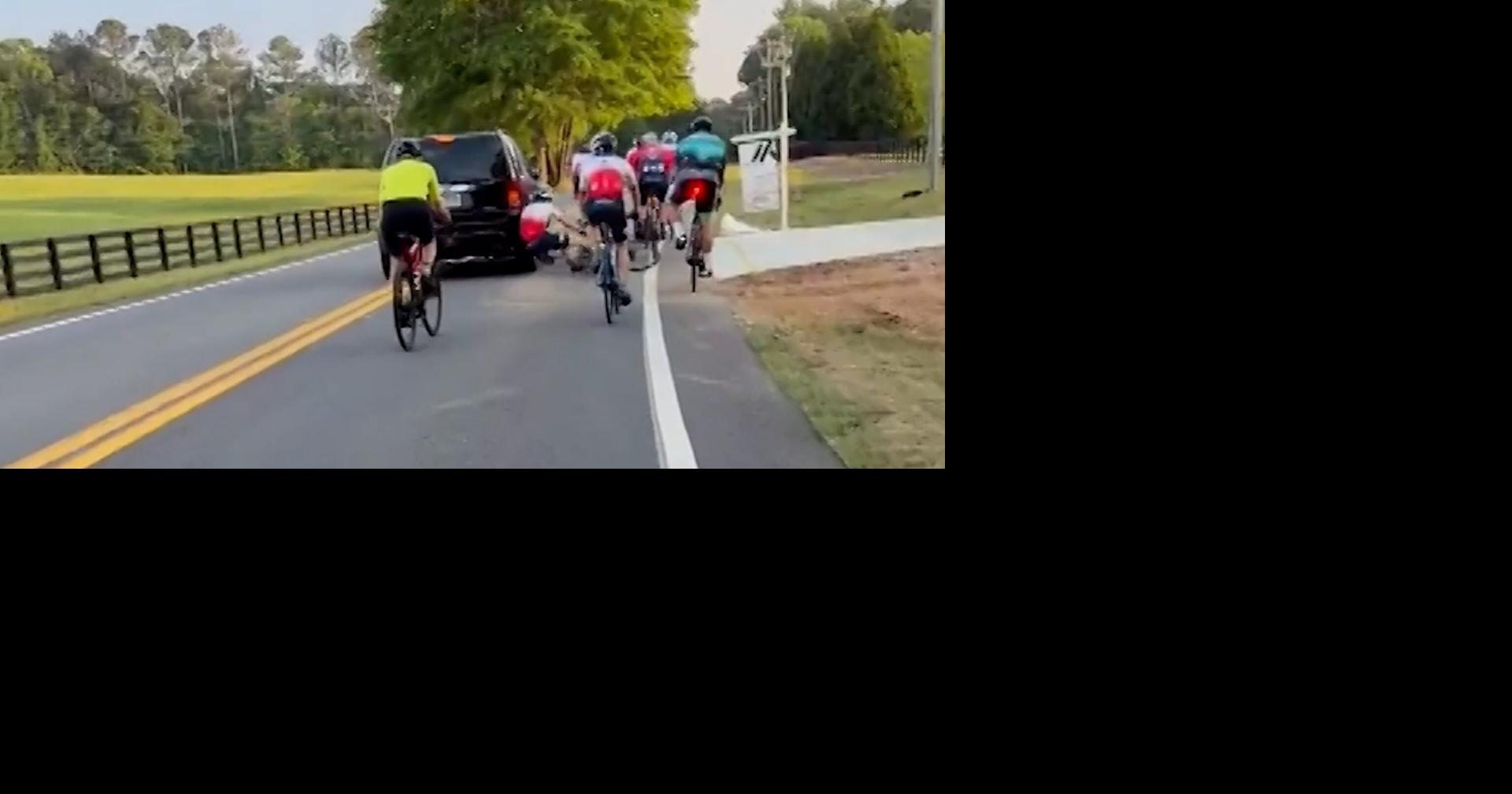 Driver appears to hit cyclists during road confrontation ...
