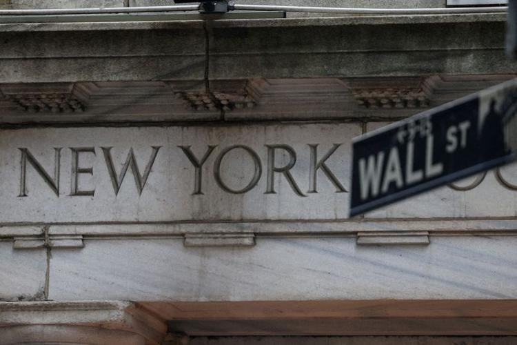 Wall Street ends slightly higher after Fed holds rates steady
