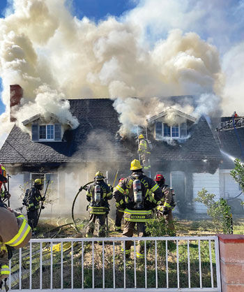 Attic fire damages 10th Street home
