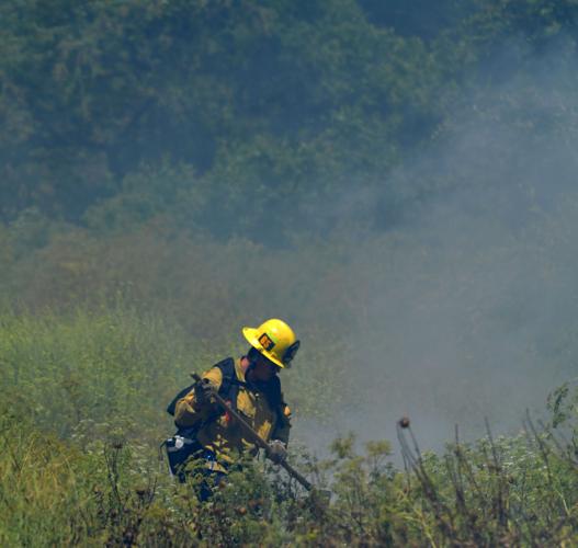 One-acre brush fire burns Wednesday afternoon alongside El Prado Road in Chino