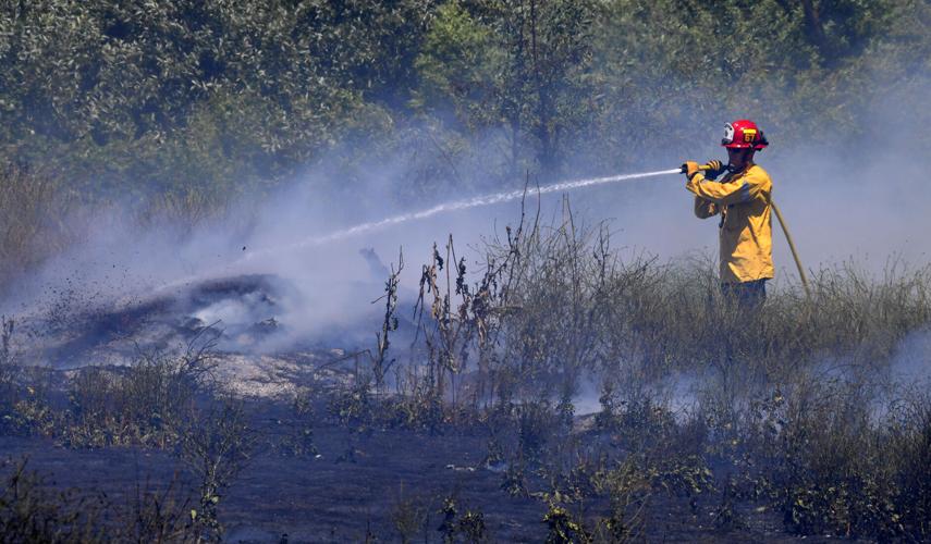 One-acre brush fire burns Wednesday afternoon alongside El Prado Road in Chino