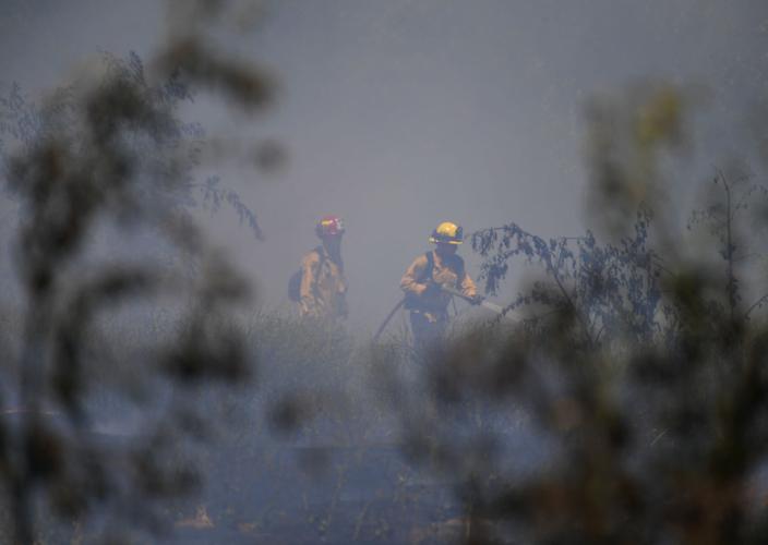 One-acre brush fire burns Wednesday afternoon alongside El Prado Road in Chino