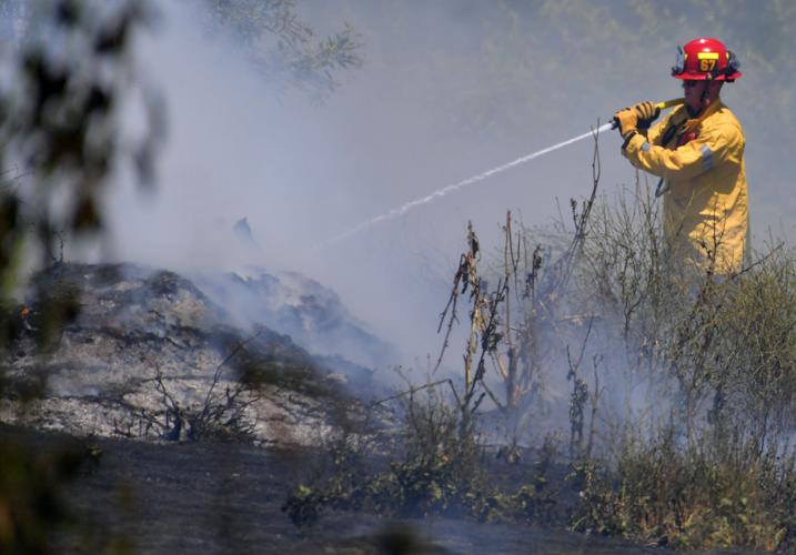 One-acre brush fire burns Wednesday afternoon alongside El Prado Road in Chino