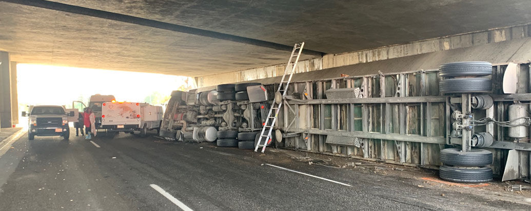 Semi truck carrying hundreds of chickens overturns on Grand Avenue