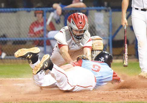 Fisher tagging runner out at home