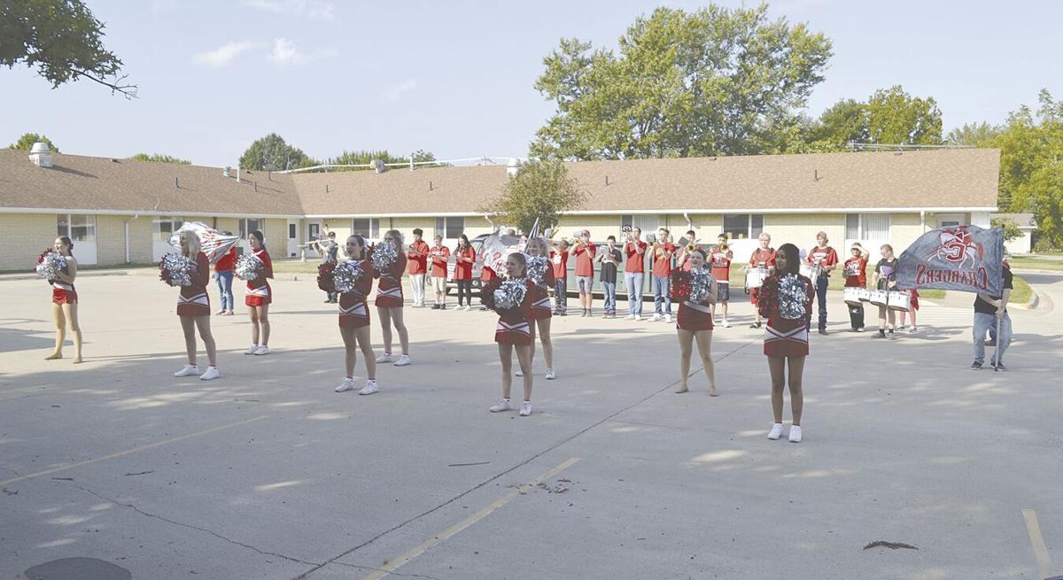 cheerleaders and band performing at Chariton Specialty Care.tif