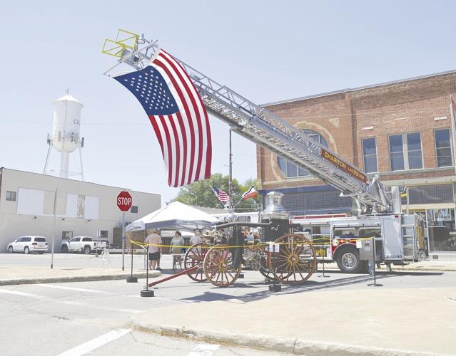 Old Betsy steam engine and Ladder fire truck on display.tif