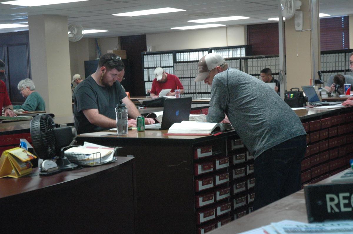 Despite oil downturn, landmen still crowd courthouse News