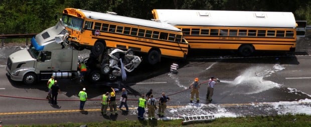 Update School buses collide with wreck killing 2 injuring dozens