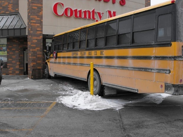 School bus rolls into pontoon front of store