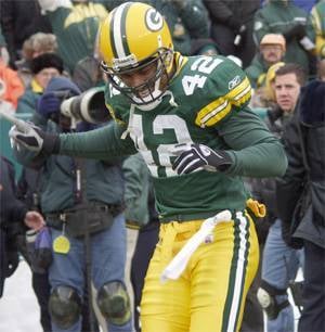 JUSTIN ARNOLD / THE CHIPPEWA HERALD — The Packers' Darren Sharper dances  during player introductions against the Chicago Bears in this Dec. 1, 2002  file photo in Green Bay. Sharper may not