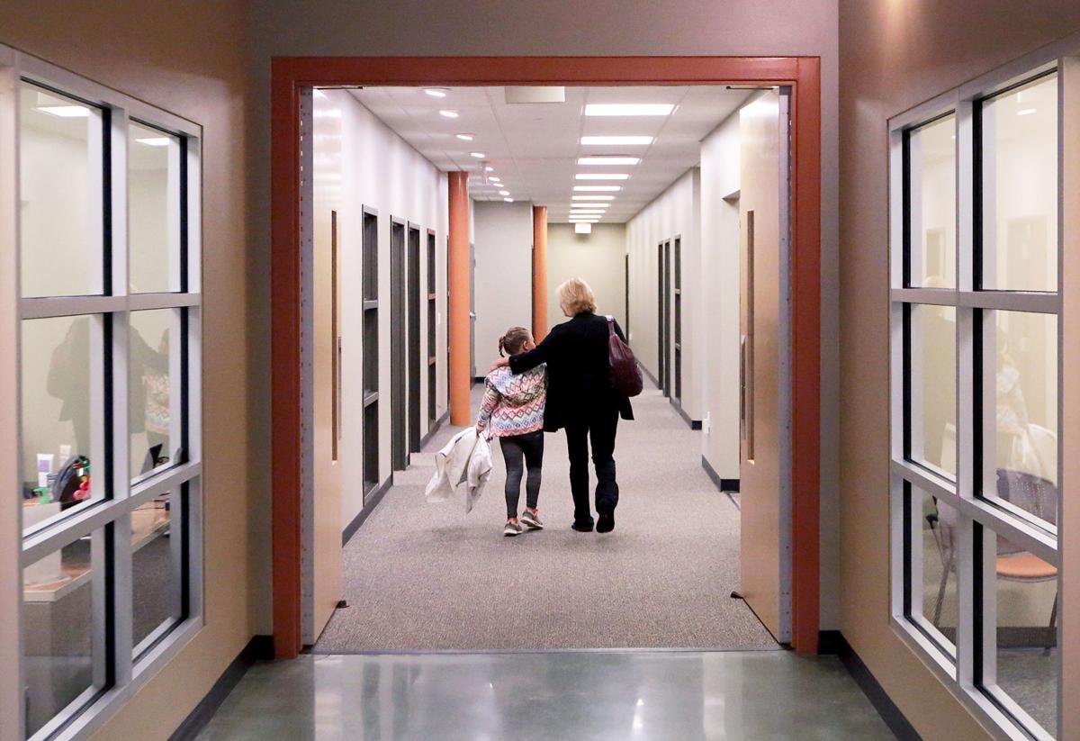 Donna and Natalie walking down hallway