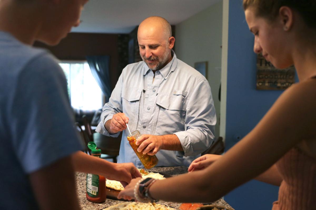Mike making pizza