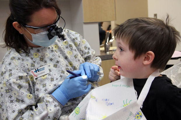 Dental pros students work to Give Kids a Smile