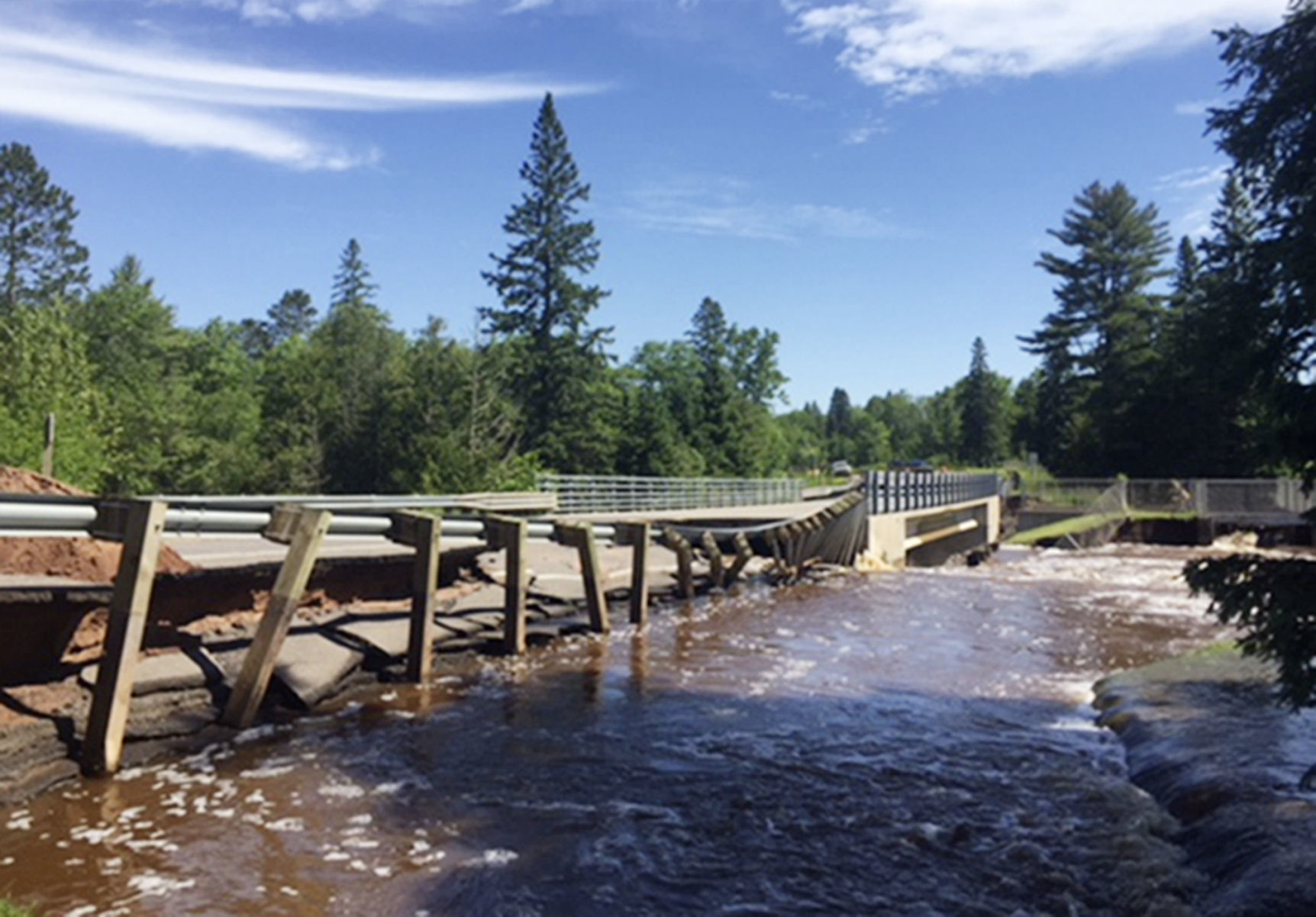 Death washed out roads amid flooding in Upper Midwest