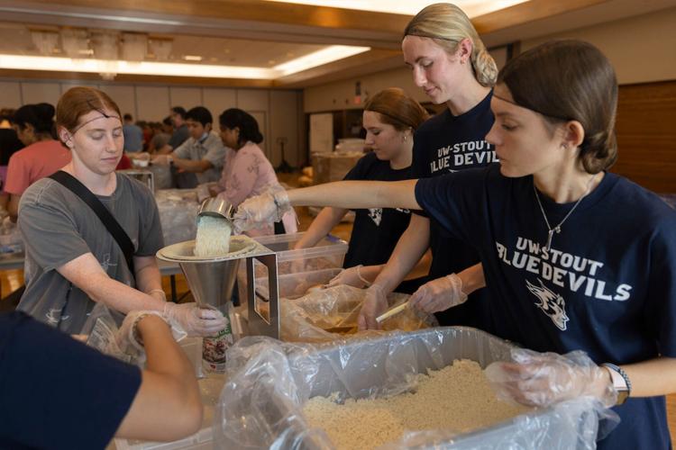 Meal Pack-a-Thon, students helping