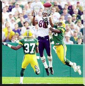 THE ASSOCIATED PRESS ---- Chicago Bears' Marcus Robinson (88) catches a  68-yard touchdown pass despite pressure from Green Bay Packers' Tyrone  Williams (37) and LeRoy Butler in the second quarter Sunday in Green Bay.