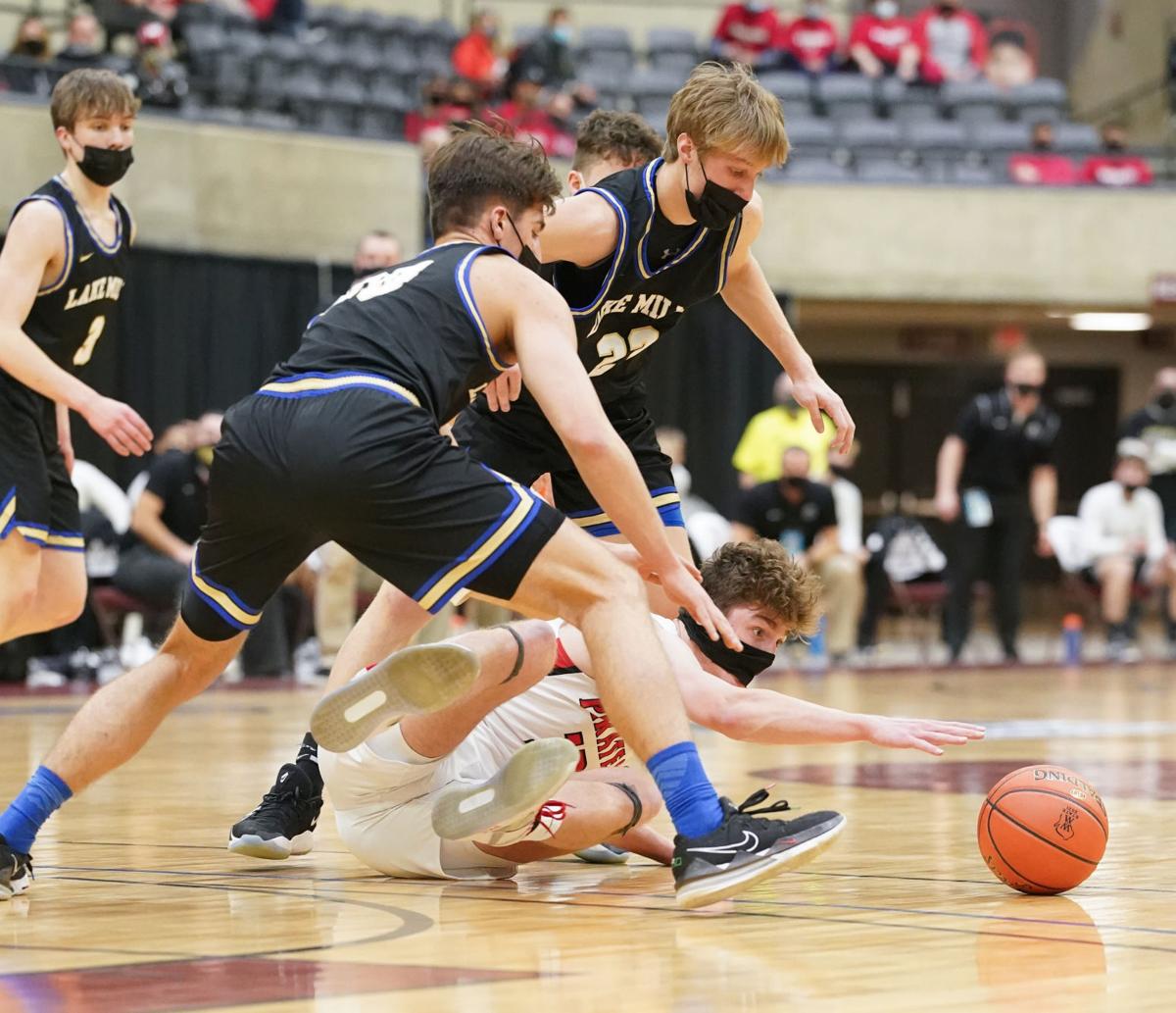 WIAA boys basketball photo: Lake Mills' Jaxson Retrum and Charlie Bender chase a loose ball