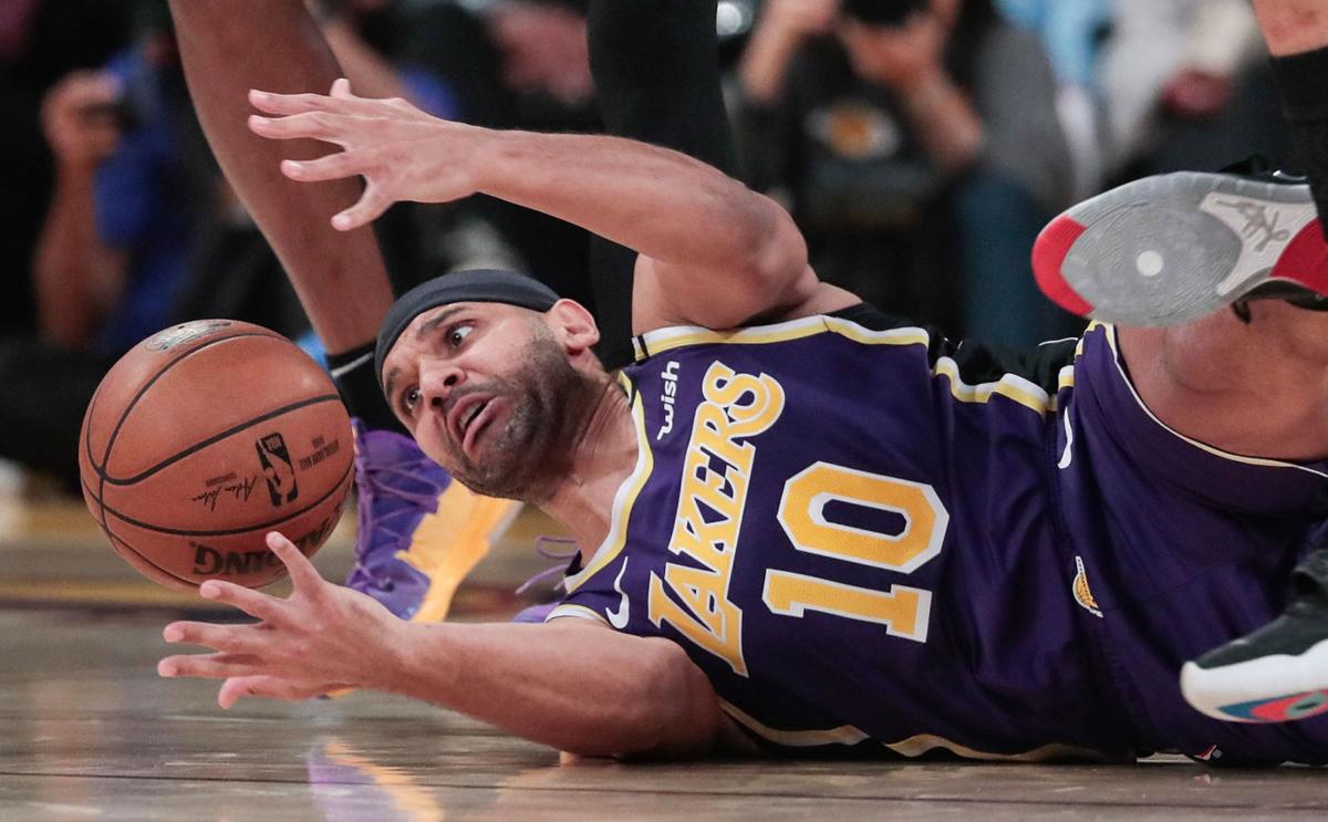 The Los Angeles Lakers' Jared Dudley scrambles after a loose ball against the Orlando Magic at Staples Center in Los Angeles on January 15, 2020.