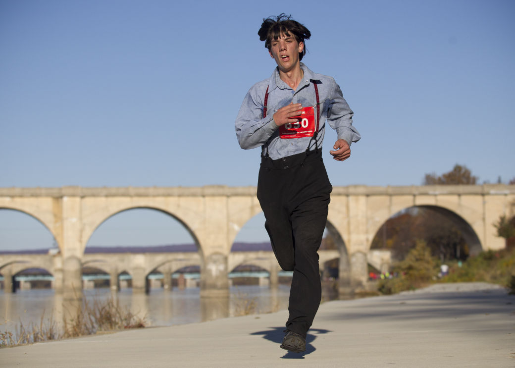 Amish man runs marathon in traditional slacks and suspenders