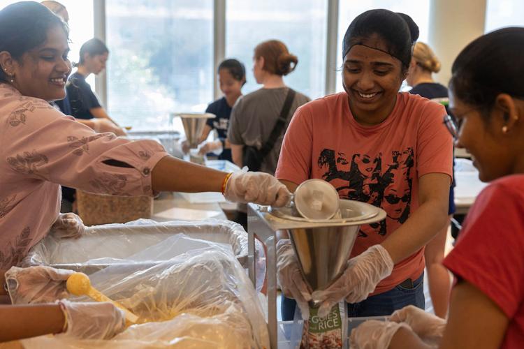 Meal Pack-a-Thon, students helping