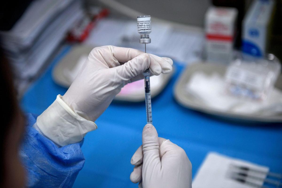 Pfizer says Covid-19 vaccine protection lasts at least six months, protects against variants