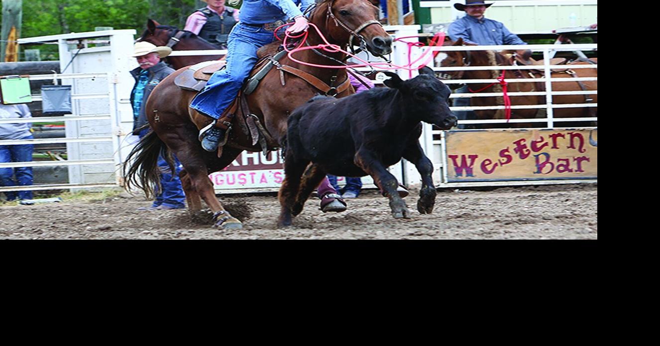 Rain doesn't deter rodeo fans