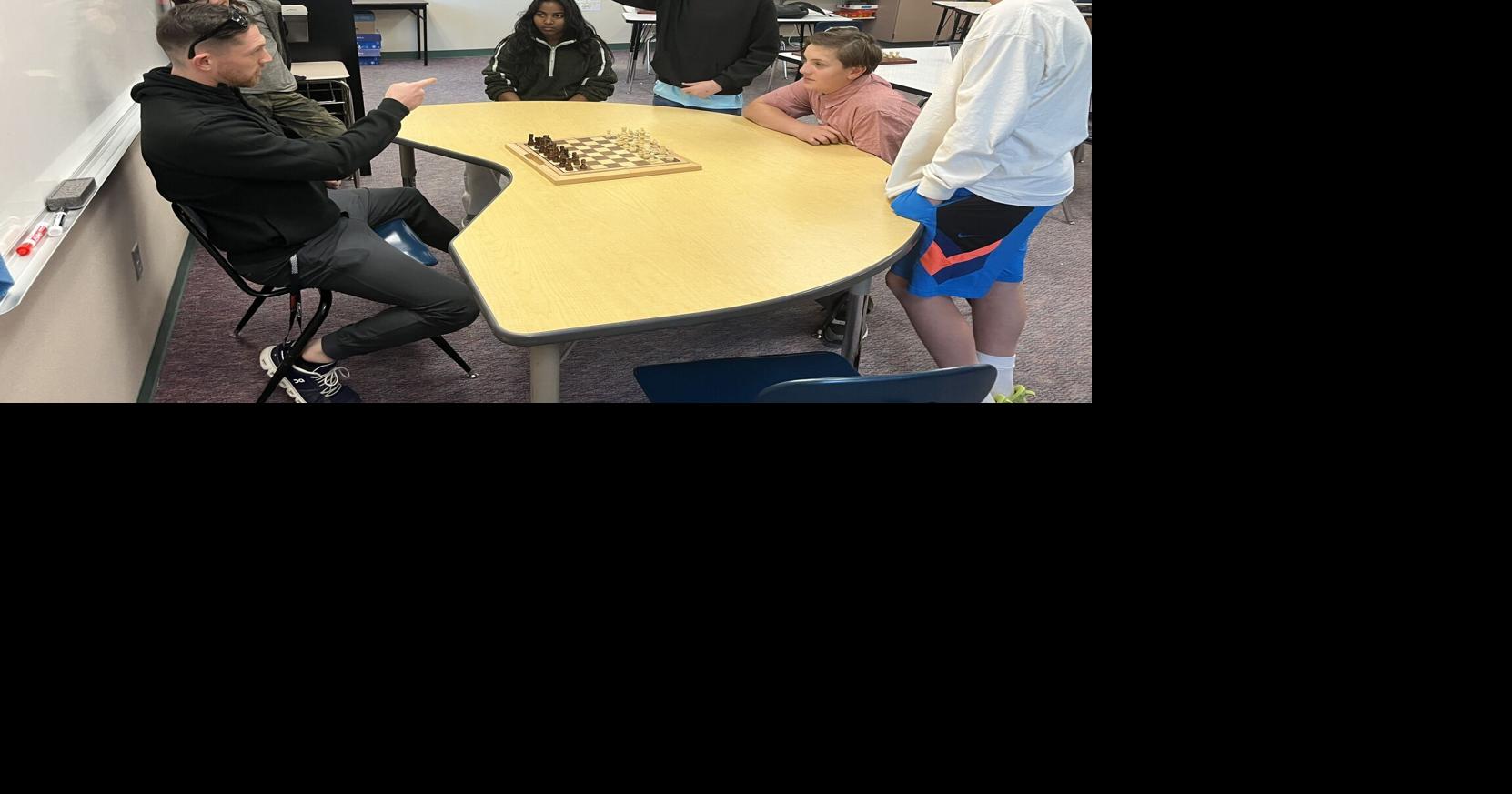 National chess master visits middle school chess club
