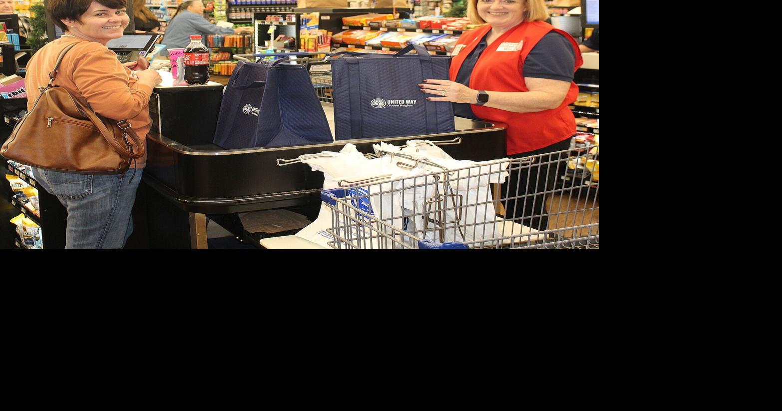 Local ‘celebrities’ bag groceries for tips