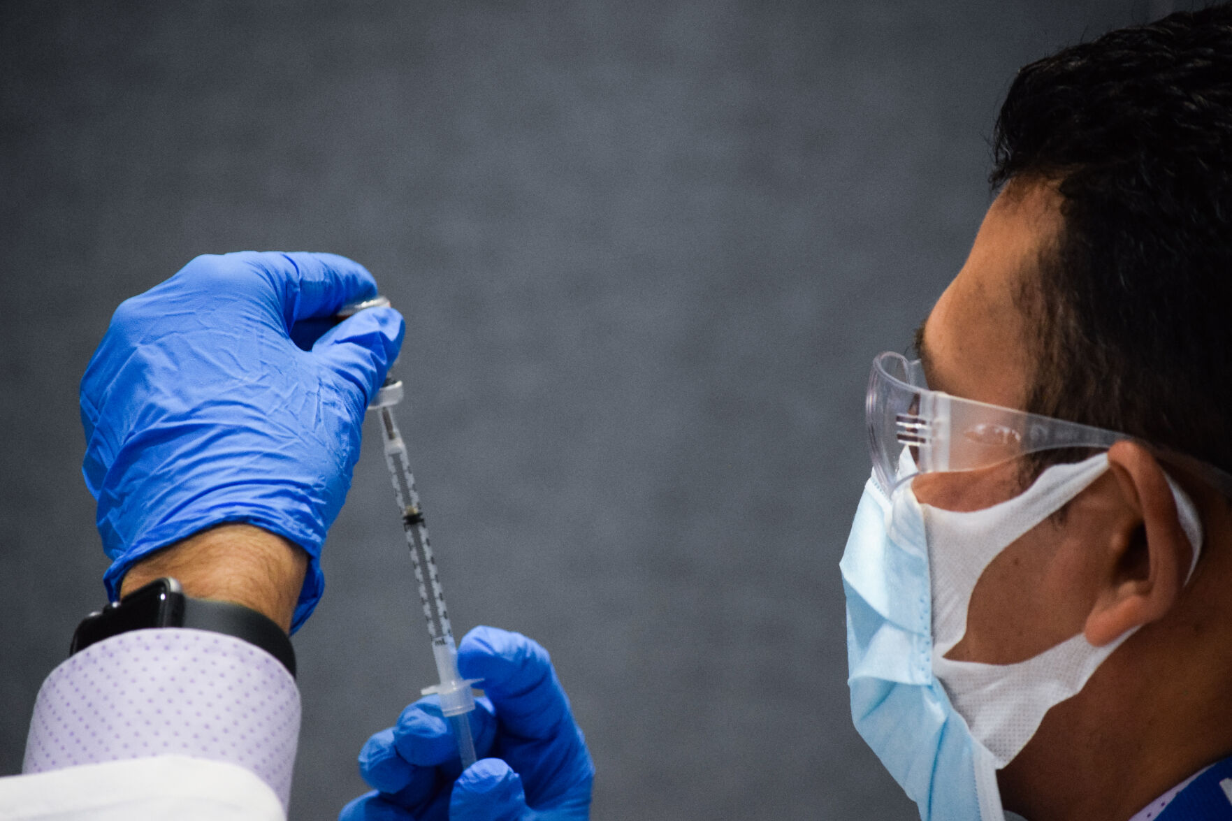 Front-line workers vaccinated in 'historic' moment | Local News - Vimarsana News