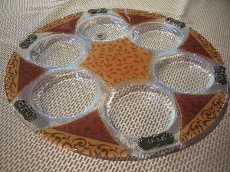 Seder plates from near and far Holidays