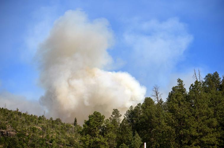 New Mexico wildfire claims second life, while rain offers hope of