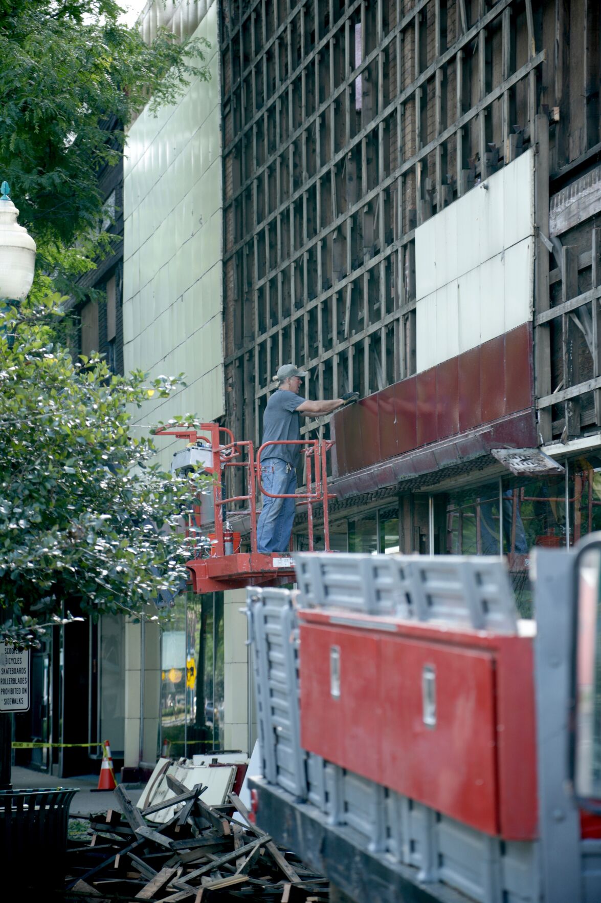 Bill Twyford removes tiles from Volckman building