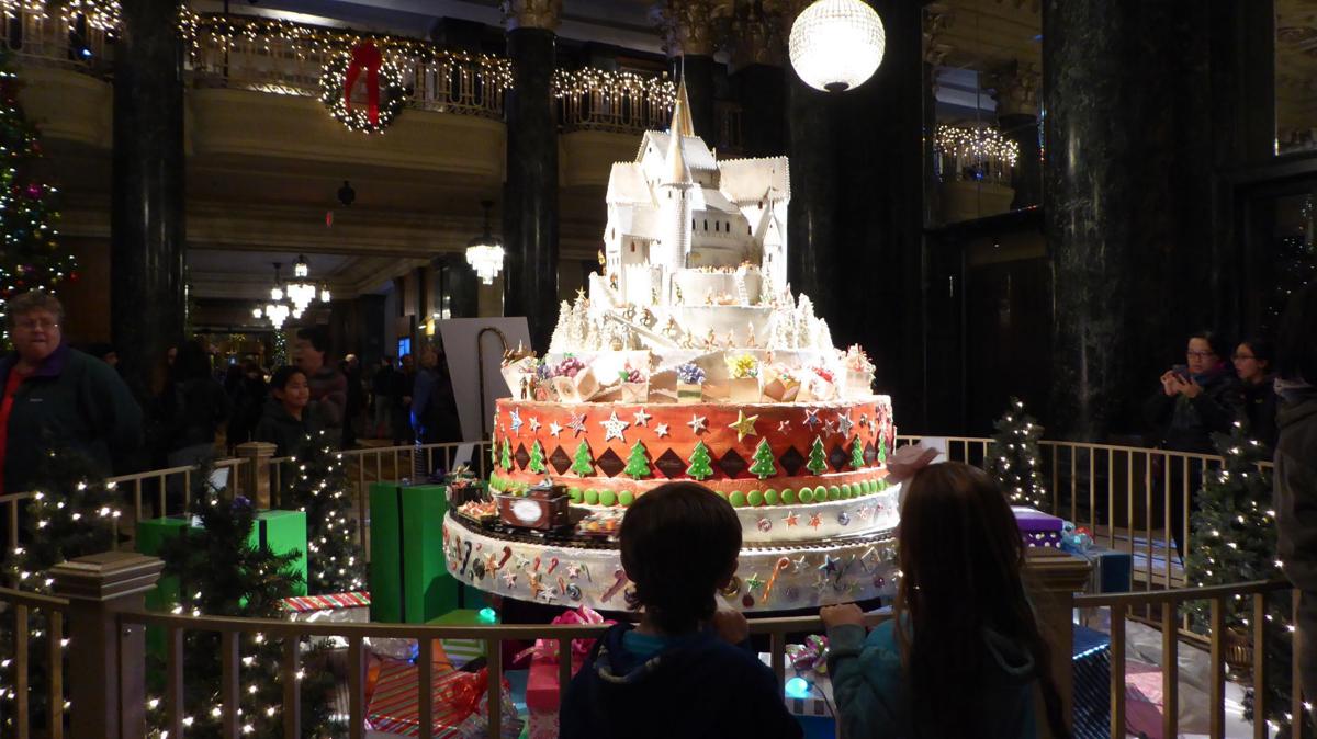 A large gingerbread house built as a castle greet visitors to the lobby at the Westin Saint Francis A model train circles below