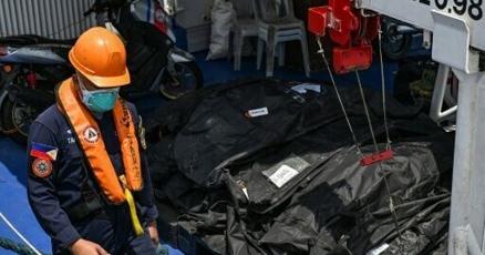 Philippine rescuers pull more victims from charred ferry