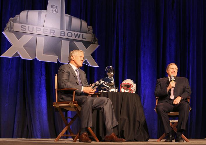 Seattle Seahawks head coach Pete Carroll and New England Patriots head coach Bill Belichick participate in a joint press conference in Phoenix.