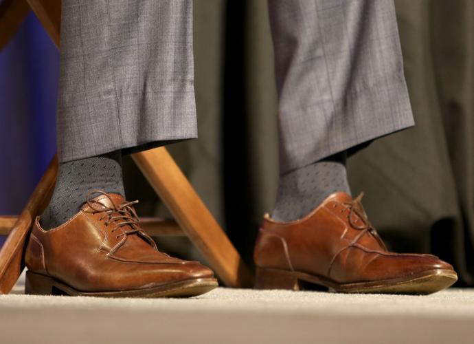 Seattle Seahawks head coach Pete Carroll wears brown dress shoes with laces for his morning press conference.