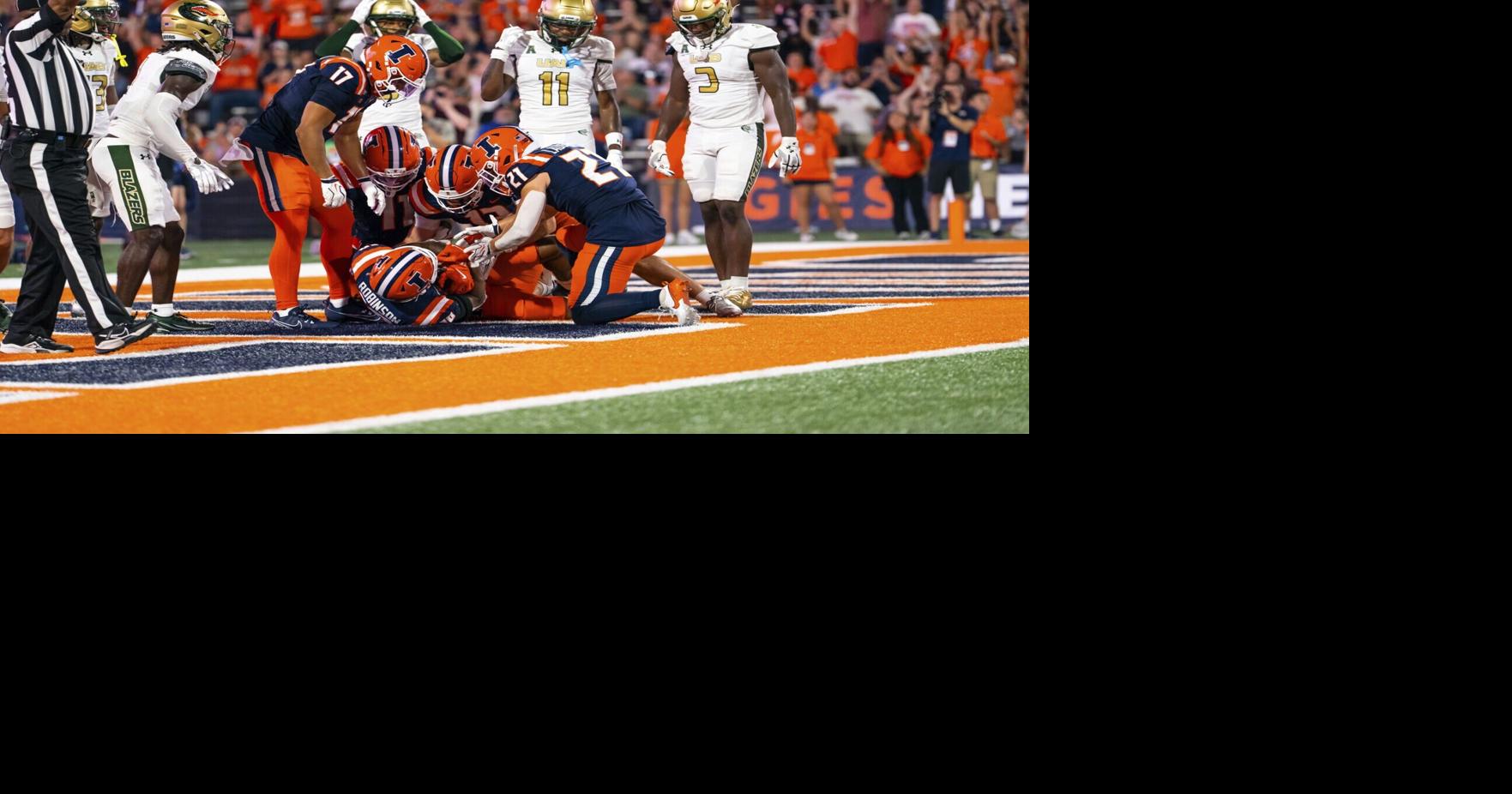 COLLEGE FOOTBALL: Houser's Hail Mary boosts Illinois