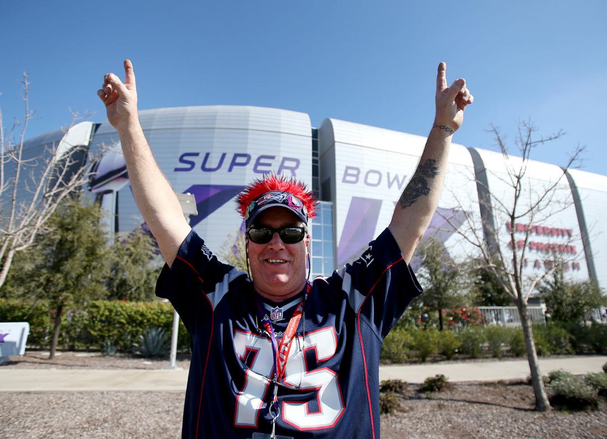 Ed Ronan, of Salem, Massachusetts, and now living in Rowley, Massachusetts, poses for a photo outside the stadium before the start of Super Bowl XLIX in Glendale, Ariz.