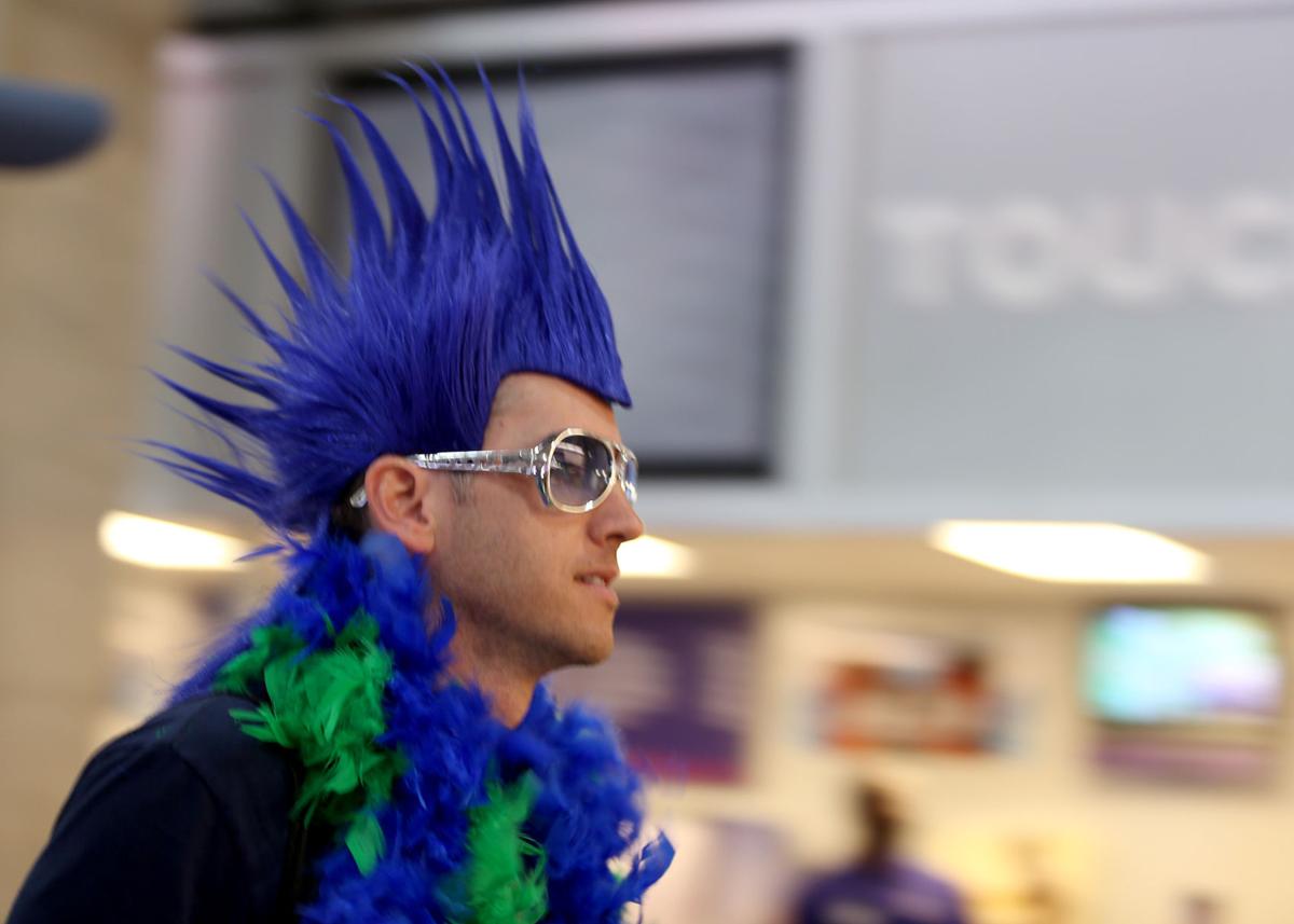 A Seattle Seahawks fan walks through the stadium concourse.