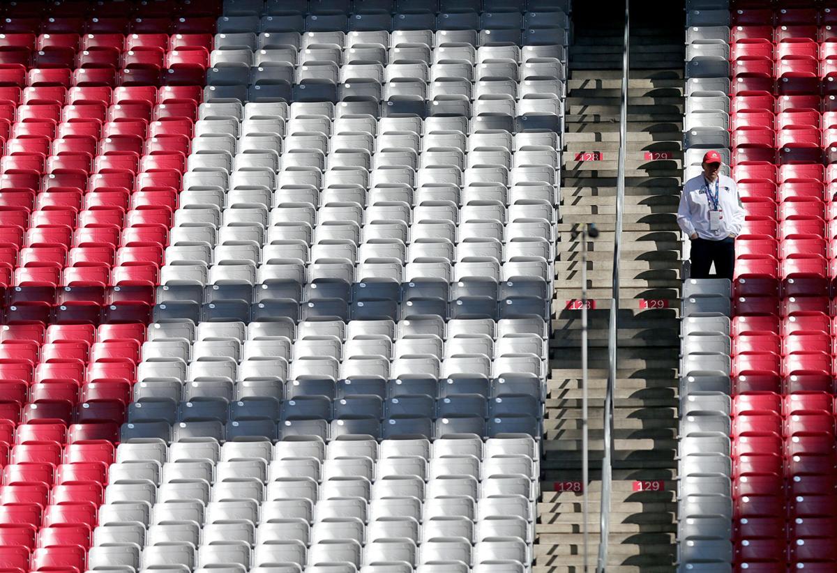 Longtime Patriots fan Bill Perocchi, from Lawrence, and CEO of Pebble Beach, stands in his row well ahead of any other fans before the start of Super Bowl XLIX.