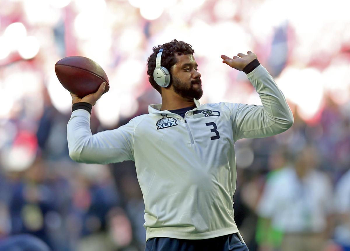 Seattle Seahawks quarterback Russell Wilson (3) takes warmup throws before the start of Super Bowl XLIX.