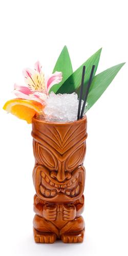 Tropical cocktails served in a tiki style glass and garnished with fruits