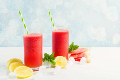 Summer watermelon drink in glasses with lemon and mint